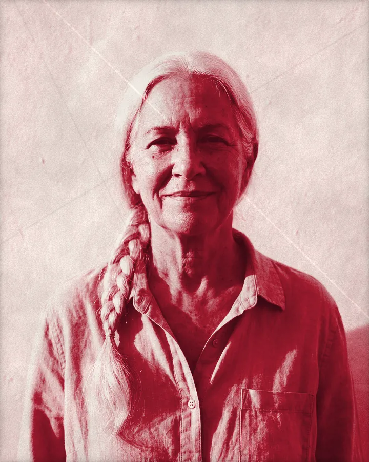 Portrait of an older woman with a long white braid over her shoulder, printed for the wall