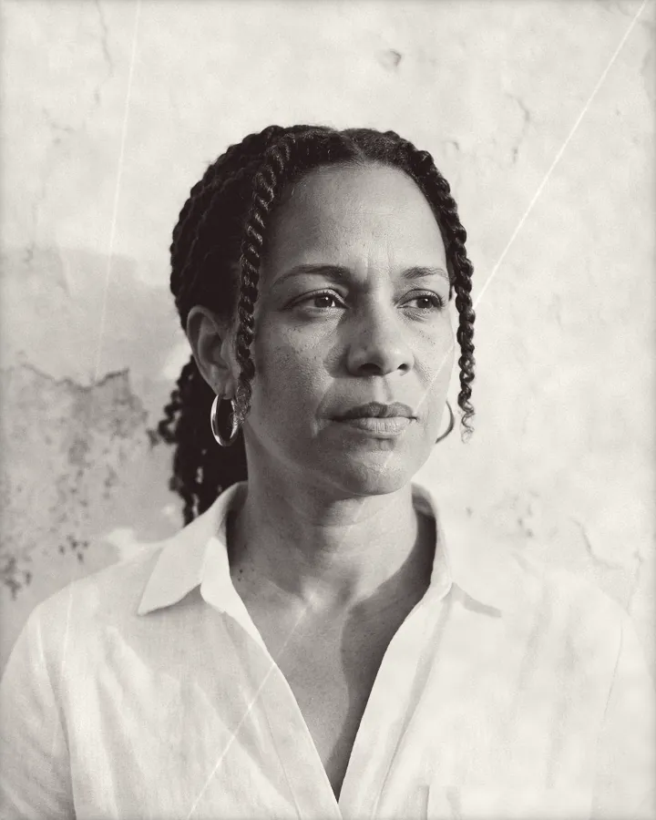 Portrait of a thoughtful woman with two-strand twists and gold earrings, printed for the wall