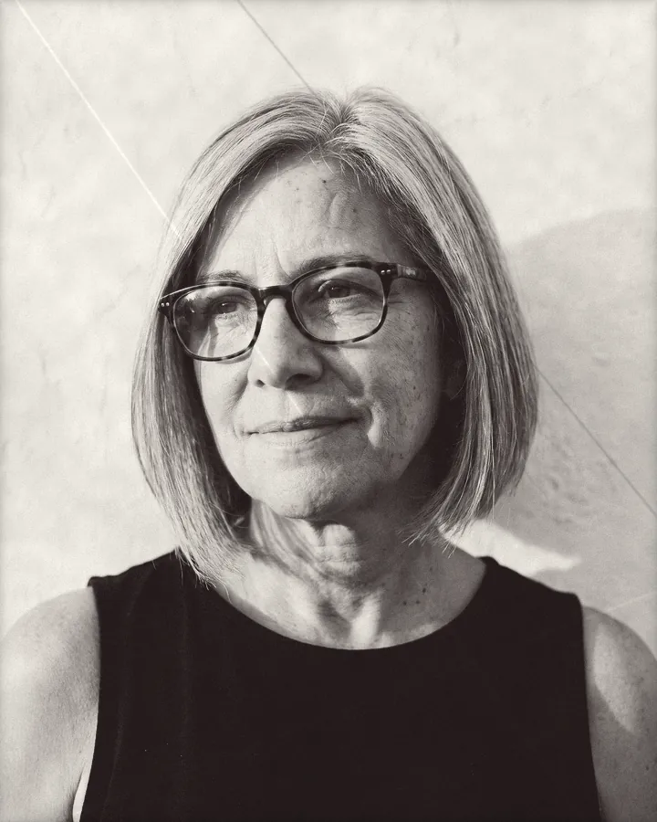 Portrait of a woman with an ash-blonde bob and tortoiseshell glasses, printed for the wall