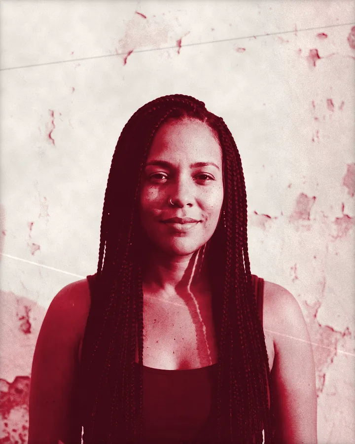 Portrait of a woman with waist-length box braids and a gold nose ring, printed for the wall